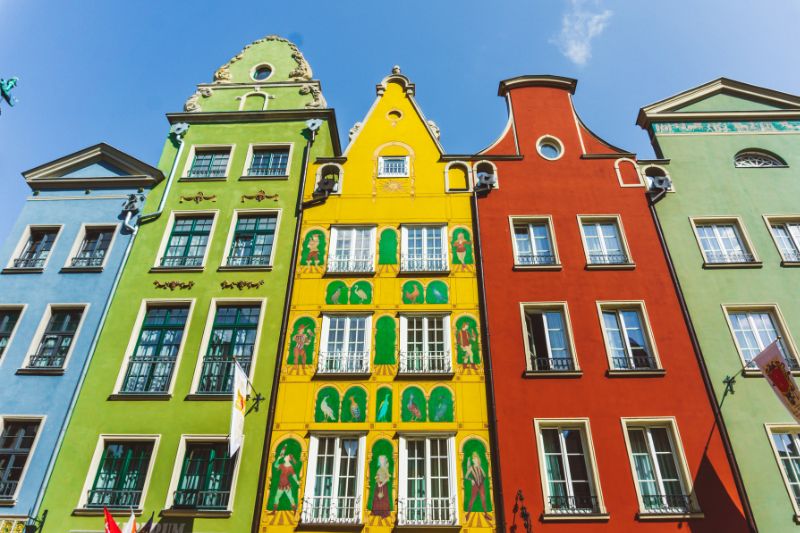 Vibrant row of colorful tenement houses along Długi Targ in Gdańsk.