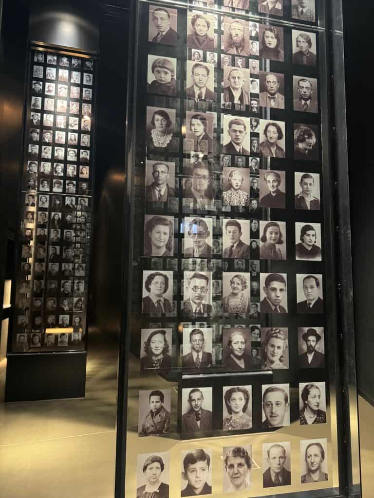 Wall of black-and-white headshots of Jewish victims of World War II at the Museum of the Second World War in Gdansk, Poland, commemorating those who perished during the Holocaust.